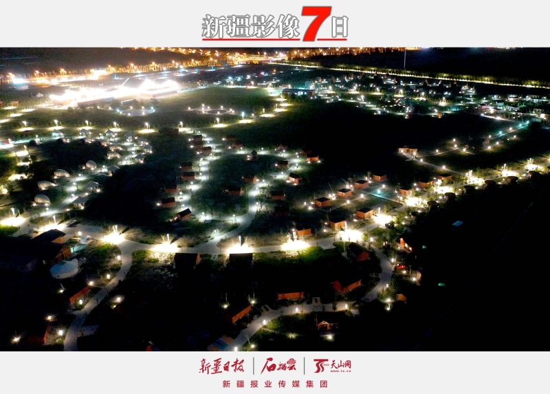 宛若銀河——   7月25日，烏爾禾國際房車露營公園夜景。進入盛夏時節(jié)，克拉瑪依市烏爾禾區(qū)新興旅游項目迎來大量嘗鮮的游客。其中，烏爾禾國際房車露營公園頗為引人注目。營地內房屋星羅棋布，日間游客可體驗各種游樂項目，夜間可在“宛若銀河”的營地內吃燒烤、看星空，感受多彩生活。石榴云/新疆日報記者 韓亮攝